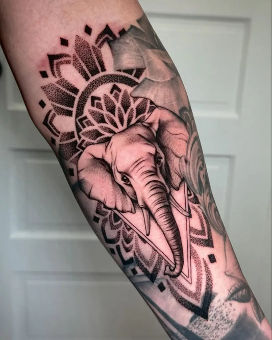 Medium Black and Grey Elephant Mandala Tattoo on Men Arm by @maditattoos