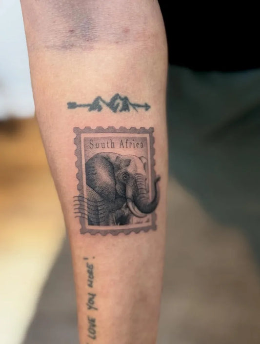 Medium Black and Grey Elephant Stamp Tattoo on Women Arm by @jamesychain.tattoos