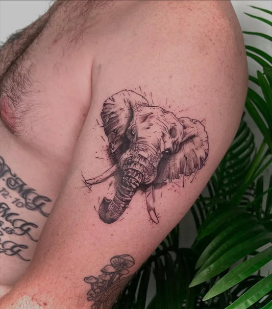 Medium Black and Grey Elephant Tattoo on Men Arm by @hoki.tattoostudio