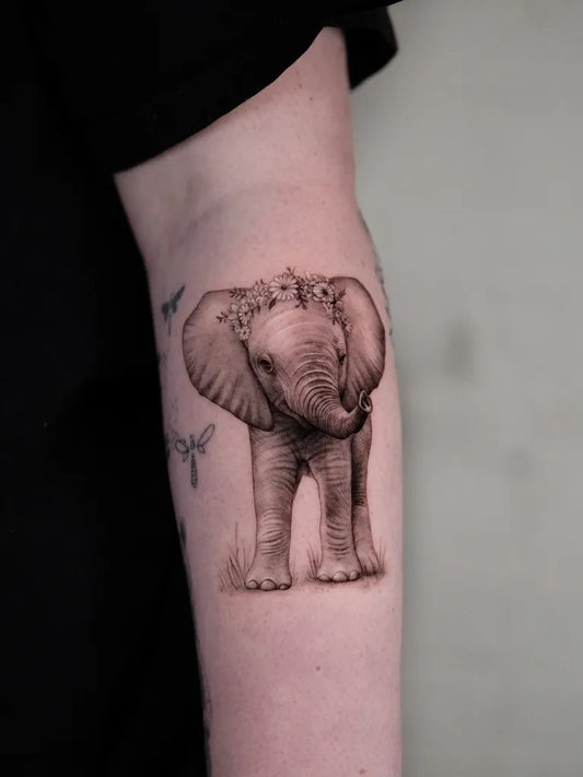 Medium Black and Grey Elephant with Butterflies and Flowers Tattoo on Women Arm by @law_ink