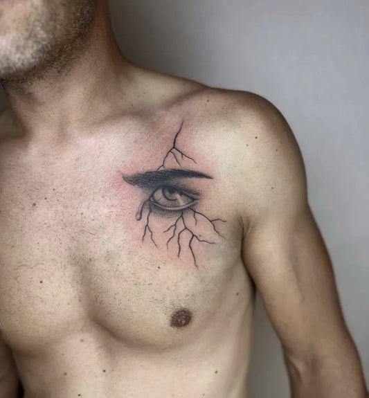 Medium Black and Grey Eye and Lightning Tattoo on Men Shoulder by @katia.iink