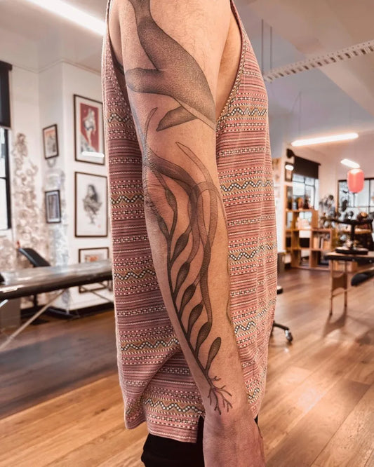 Medium Black and Grey Feather Tattoo Spiritual Tattoo on Men Arm by @sarahpeteh