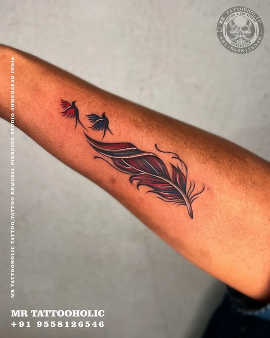 Medium Black and Grey Feather and Birds Tattoo on Men Arm by @mr_tattooholic_ahmedabad