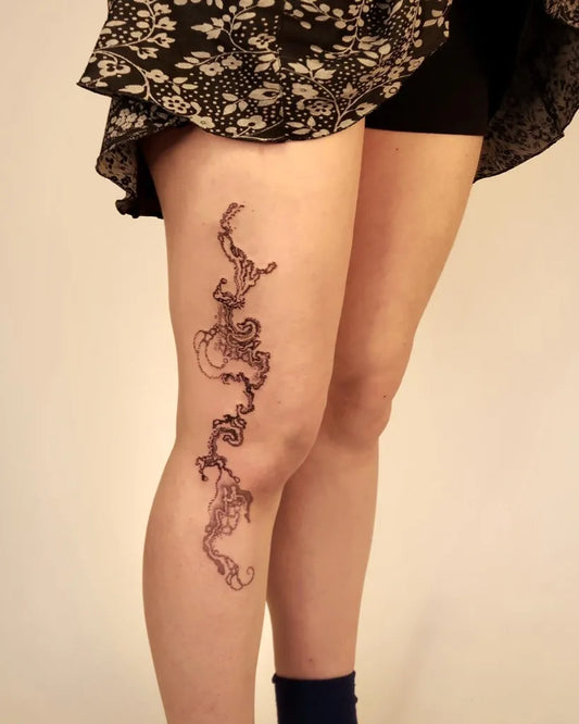 Medium Black and Grey Filigree Vines Spiritual Tattoo on Women Thigh by @jangmi.ink