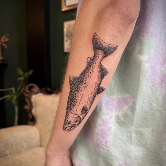 Medium Black and Grey Fish Tattoo on Men Arm by @blackstone_tattoo_