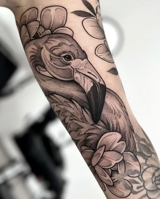 Medium Black and Grey Flamingo and Flowers Tattoo on Women Arm by @hipner.magdalena