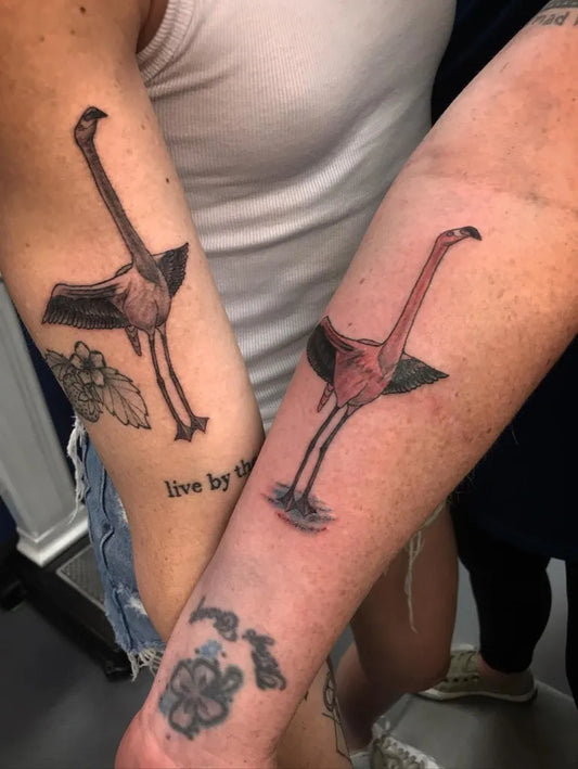 Medium Black and Grey Flamingo and Hibiscus Tattoo on Women Arm by @sloweace