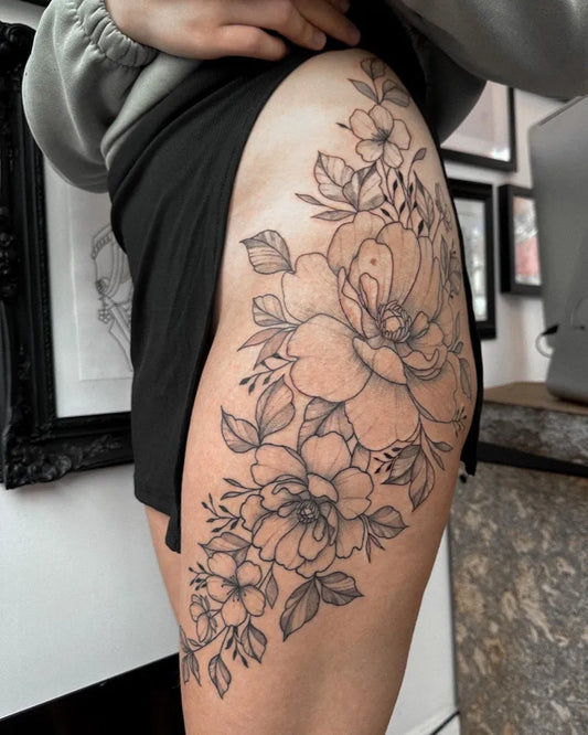 Medium Black and Grey Flower Bouquet Tattoo on Women Hip by @tattoosbyjus