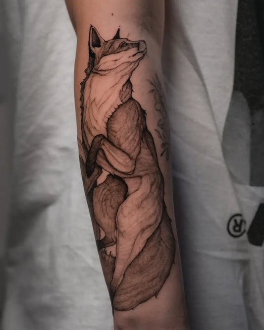 Medium Black and Grey Fox Tattoo on Men Arm by @lama_del_ray