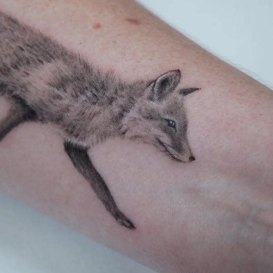 Medium Black and Grey Fox Tattoo on Women Arm by @kris.tattoos