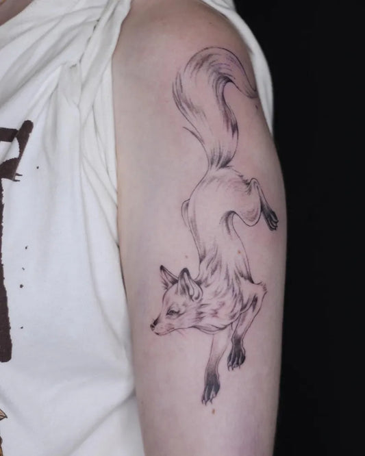 Medium Black and Grey Fox Tattoo on Women Shoulder by @faketeethink