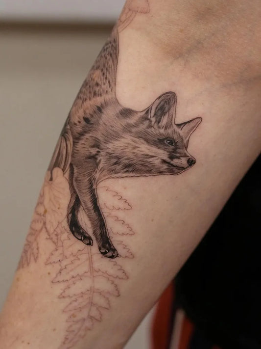 Medium Black and Grey Fox and Fern Tattoo on Women Arm by @kyla_rose_tattoo