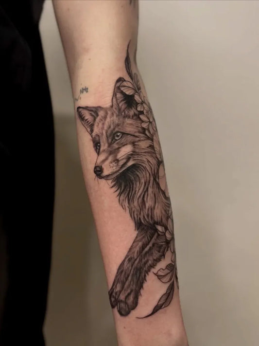 Medium Black and Grey Fox and Flowers Tattoo on Women Arm by @ntb_ink