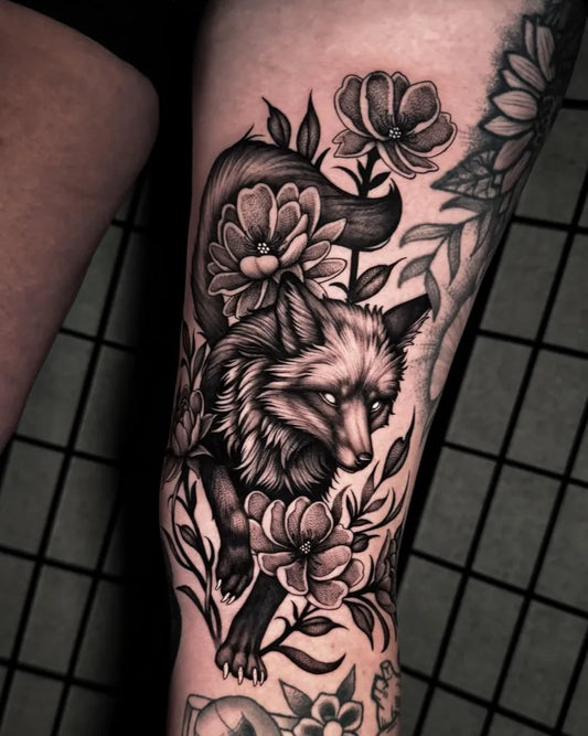 Medium Black and Grey Fox and Flowers Tattoo on Women Leg by @zebra_ink_