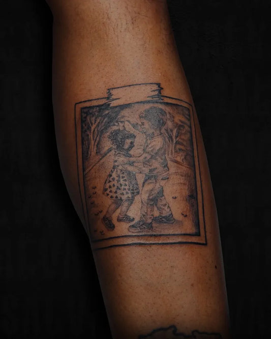 Medium Black and Grey Framed Couple Embrace Family Tattoo on Men Leg by @salvagetattoo