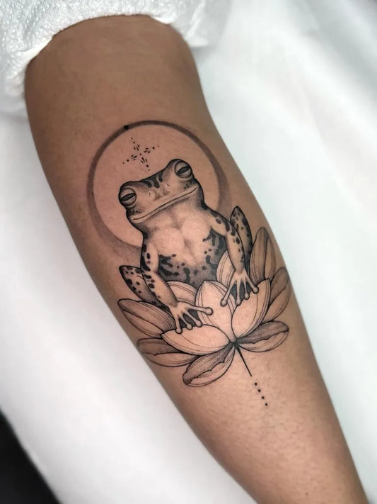 Medium Black and Grey Frog Lotus Tattoo on Women Arm by @marichyl
