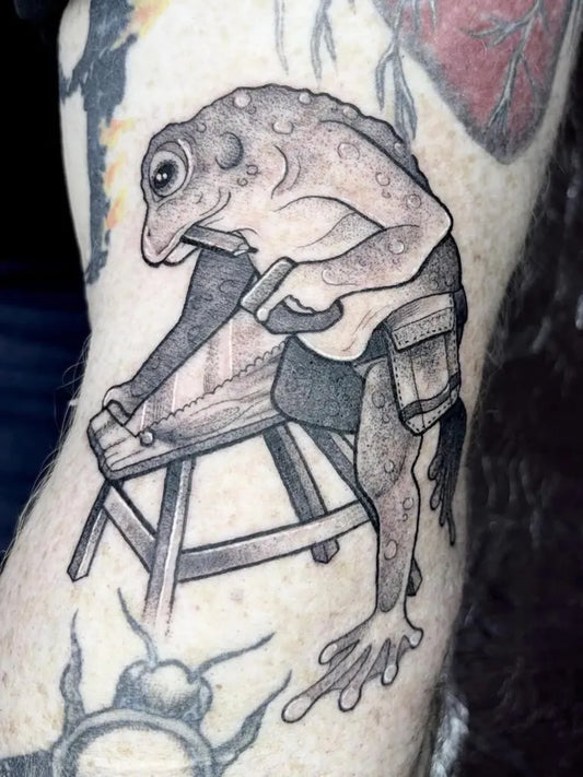Medium Black and Grey Frog Playing Guitar Tattoo on Men Arm by @portlandstreettattoo