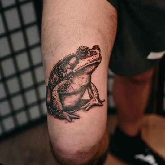 Medium Black and Grey Frog Tattoo on Men Thigh by @lorr.ink