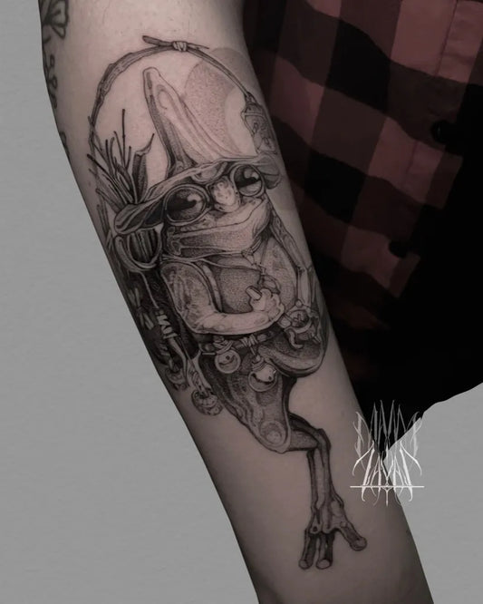 Medium Black and Grey Frog Witch Tattoo on Women Arm by @zayas.ink