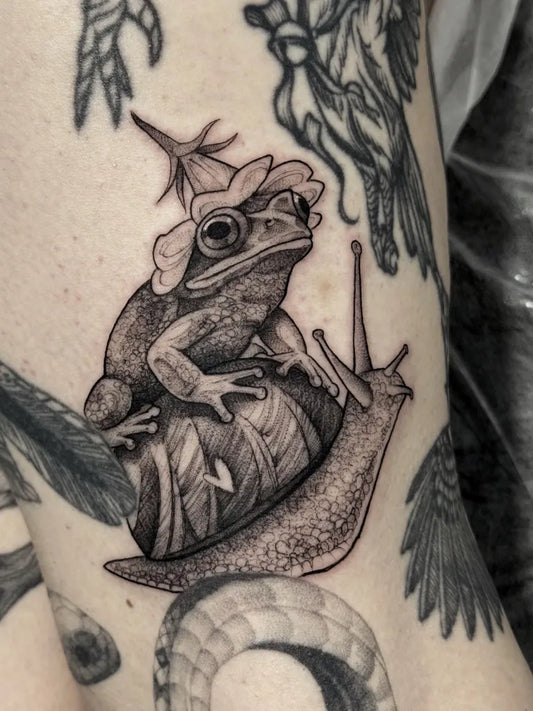 Medium Black and Grey Frog and Snail Tattoo on Men Arm by @hipner.magdalena
