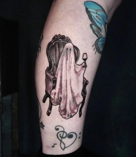 Medium Black and Grey Ghost in Chair Tattoo on Women Leg by @thevelvetaether
