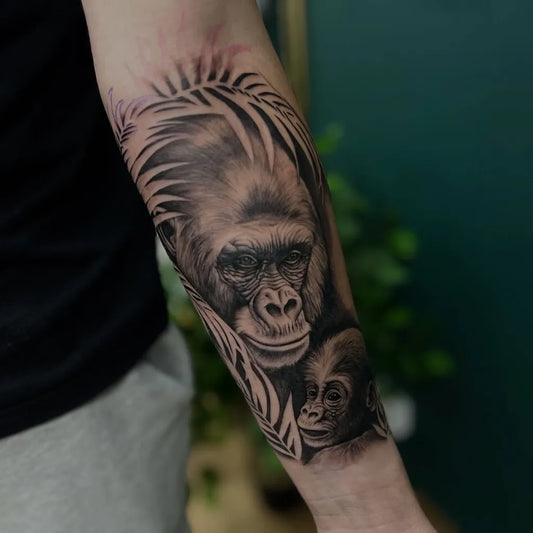 Medium Black and Grey Gorilla and Baby Tattoo on Men Arm by @vickirosstattoo