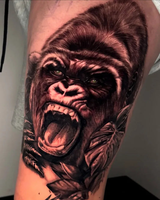 Medium Black and Grey Gorilla with Leaves Tattoo on Men Arm by @izyinks_