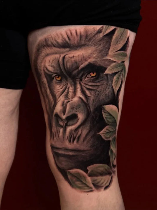 Medium Black and Grey Gorilla with Leaves Tattoo on Men Thigh by @lukevtattoo