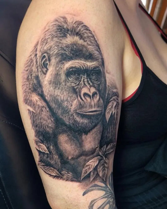 Medium Black and Grey Gorilla with Leaves Tattoo on Women Arm by @manovistudio