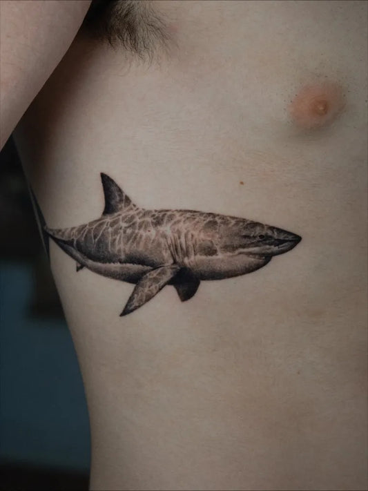 Medium Black and Grey Great White Shark on Men Ribs Tattoo by @lou_ink_