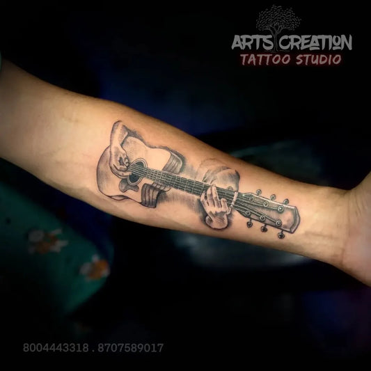 Medium Black and Grey Guitar Music Tattoo on Men Arm by @arts_creation_tattoo_studio