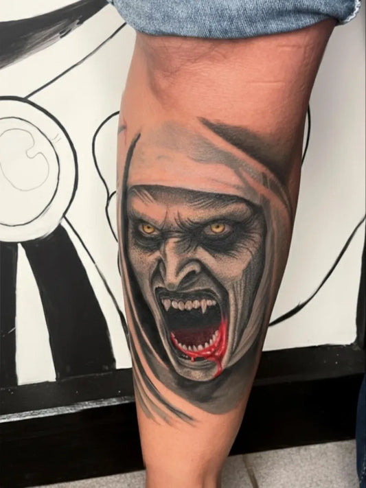 Medium Black and Grey Hooded Vampire Face Horror Tattoo on Women Thigh by @j.ink_art