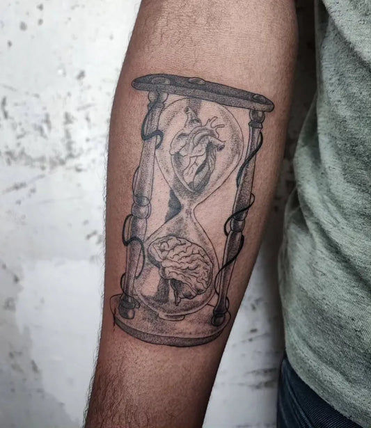 Medium Black and Grey Hourglass Heart Brain Tattoo on Men Arm by @feztattoo7