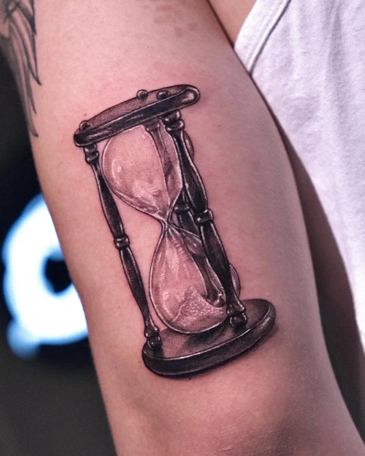 Medium Black and Grey Hourglass Tattoo on Men Arm by @coimaxtattoo