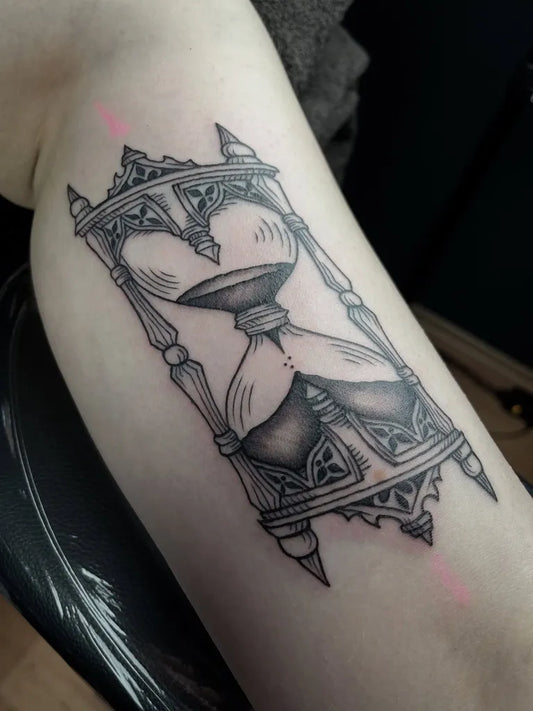 Medium Black and Grey Hourglass Tattoo on Women Arm by @liberatedink