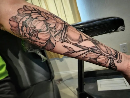 Medium Black and Grey Hourglass and Peony Tattoo on Women Arm by @dubzubtattoo