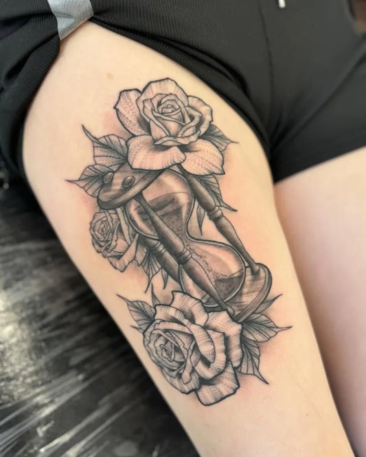 Medium Black and Grey Hourglass and Roses Tattoo on Women Thigh by @gentle_steve_tattoos