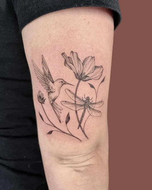 Medium Black and Grey Hummingbird Dragonfly and Flowers on Women Arm Tattoo by @alyssafazzino