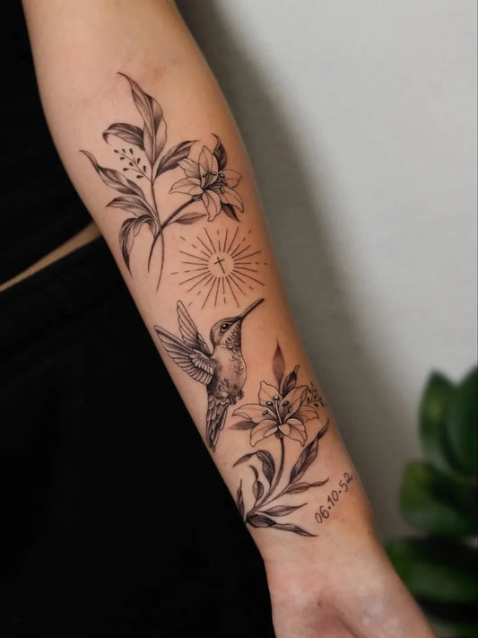 Medium Black and Grey Hummingbird Lily Sun on Women Arm Tattoo by @katareyes.tattoo