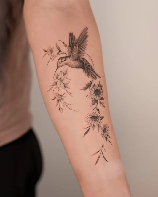 Medium Black and Grey Hummingbird and Daisies on Women Arm Tattoo by @uno.tat