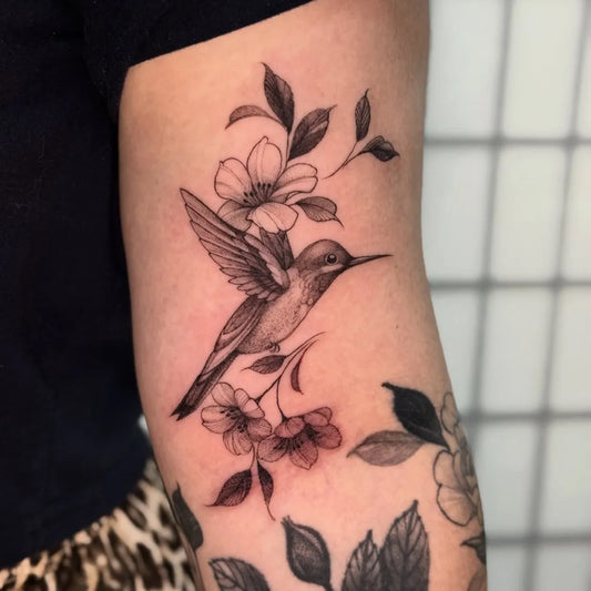 Medium Black and Grey Hummingbird and Flowers on Women Arm Tattoo by @auraespinosa