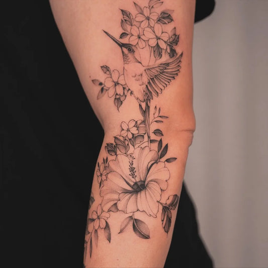 Medium Black and Grey Hummingbird and Flowers on Women Arm Tattoo by @leo.6tattoo