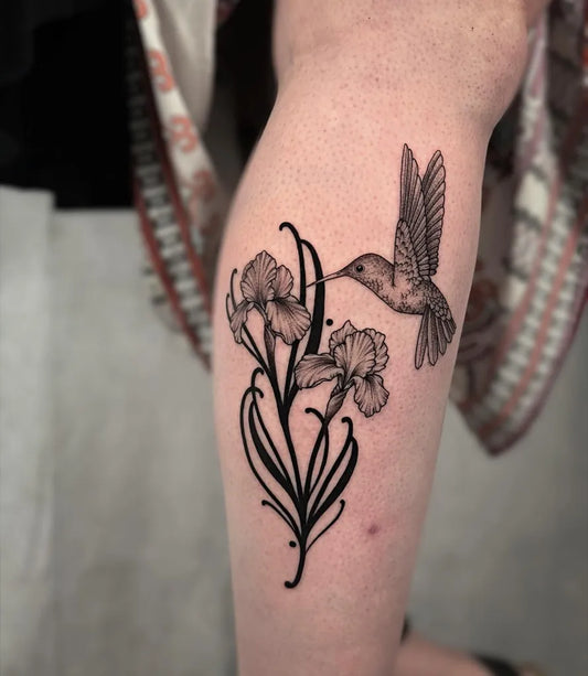 Medium Black and Grey Hummingbird and Iris Flowers on Women Leg Tattoo by @tattoowitchmal