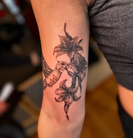 Medium Black and Grey Hummingbird and Lilies on Women Arm Tattoo by @_kathtattoos_