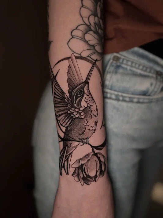 Medium Black and Grey Hummingbird and Lotus Flower on Women Arm Tattoo by @joaovillacorta