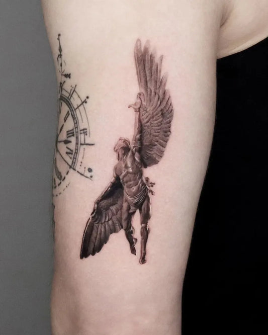 Medium Black and Grey Icarus with Angel Wings on Women Arm Tattoo by @ejintatt