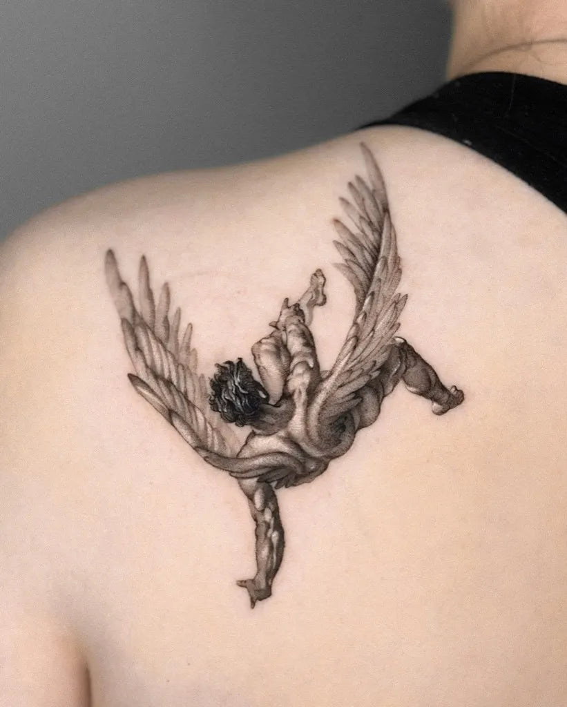 Medium Black and Grey Icarus with Wings on Women Shoulder Tattoo by @dionne.tattoo