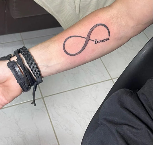 Medium Black and Grey Infinity Symbol with Love Tattoo on Men Arm by @alex.art.tattoo