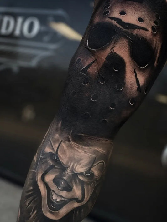 Medium Black and Grey Jason and Pennywise Horror Tattoo on Men Arm by @danny_anchor_