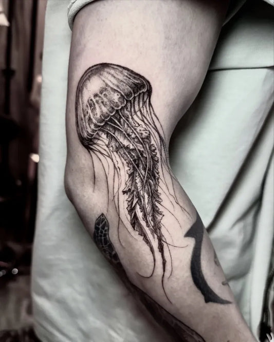 Medium Black and Grey Jellyfish Tattoo on Men Arm by @blackfish.tattoo